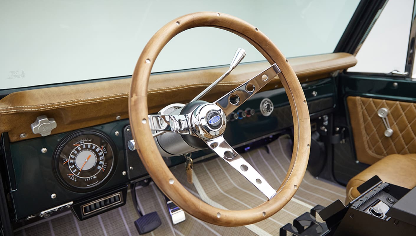 1966 ford bronco in highland green with whiskey leather interior wood steering wheel