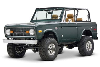 1966 ford bronco in highland green with whiskey leather interior front driver angle