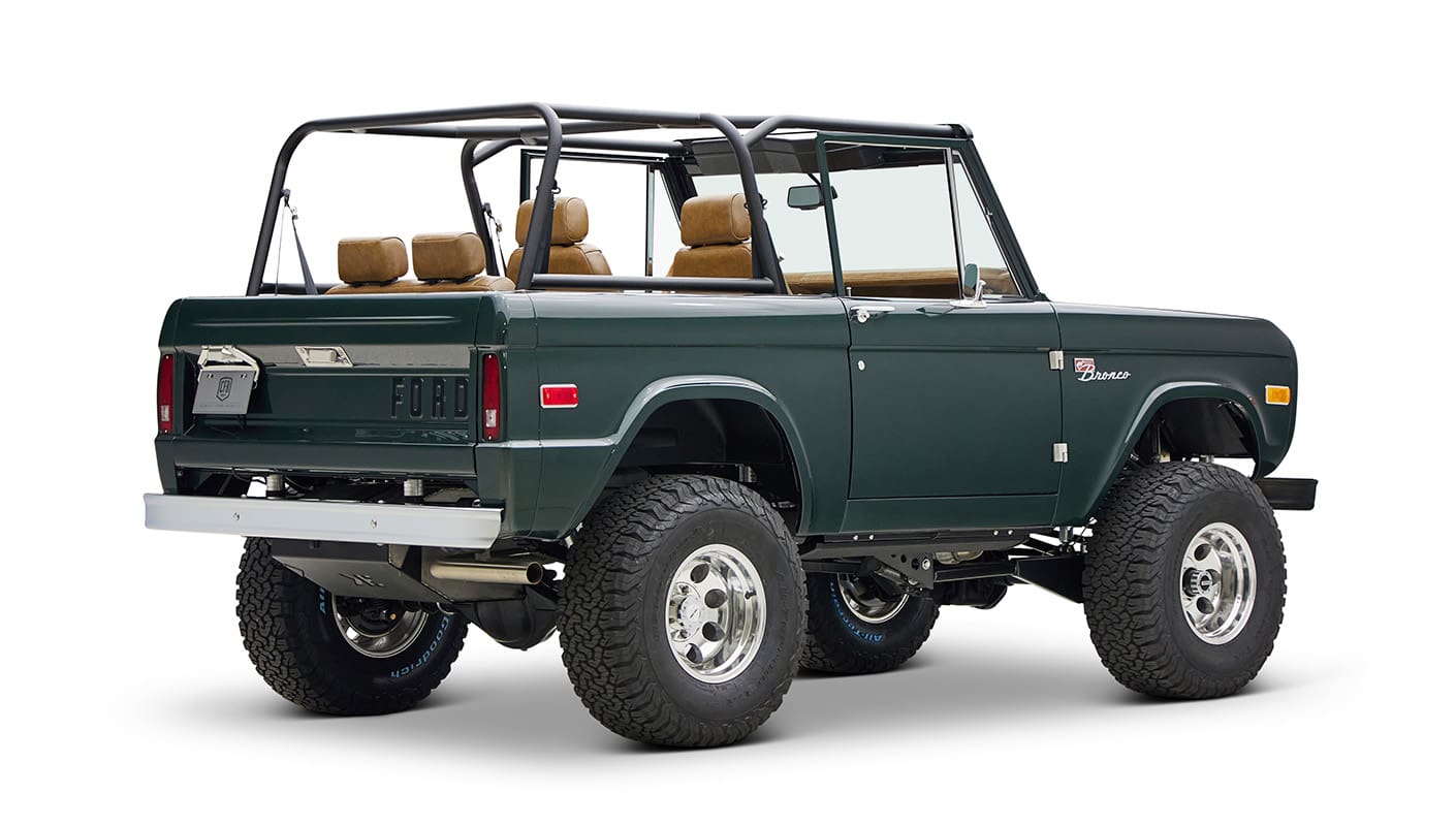 1966 ford bronco in highland green with whiskey leather interior rear passenger angle