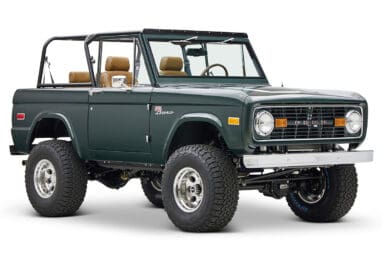 1966 ford bronco in highland green with whiskey leather interior front passenger angle
