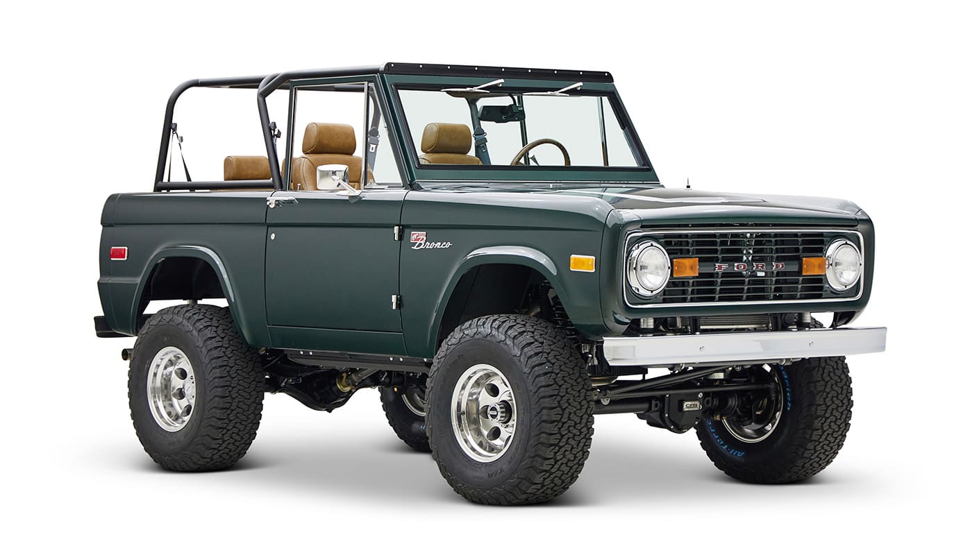 1966 ford bronco in highland green with whiskey leather interior front passenger angle
