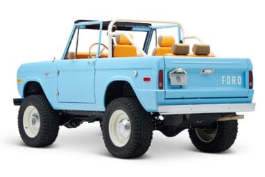 1973 Classic Ford Bronco in frozen blue with rolls royce orange leather and alpaca interior driver rear