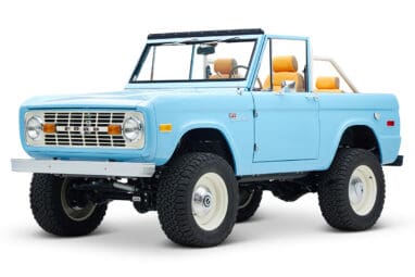 1973 Classic Ford Bronco in frozen blue with rolls royce orange leather and alpaca interior front driver