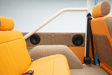 1973 Classic Ford Bronco in frozen blue with rolls royce orange leather and alpaca interior rear speaker panel