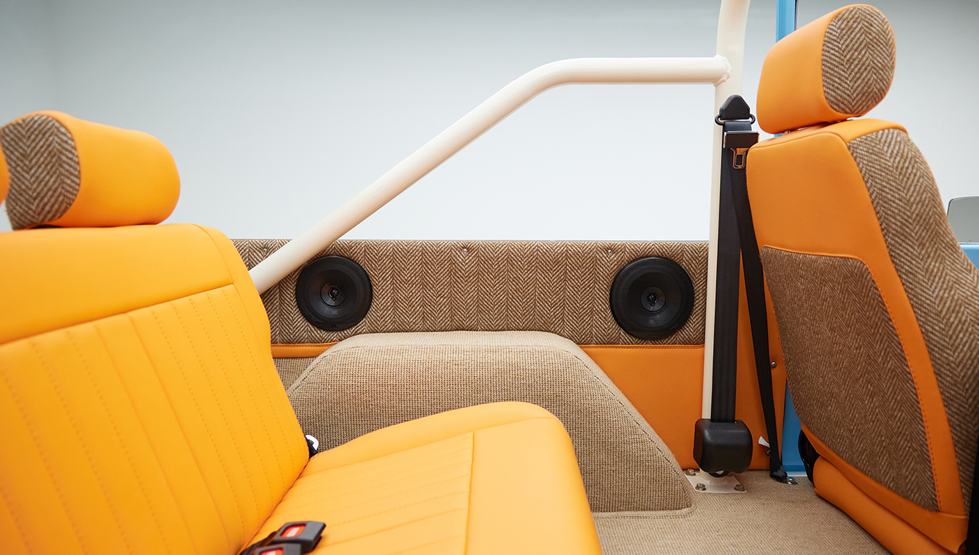 1973 Classic Ford Bronco in frozen blue with rolls royce orange leather and alpaca interior rear speaker panel