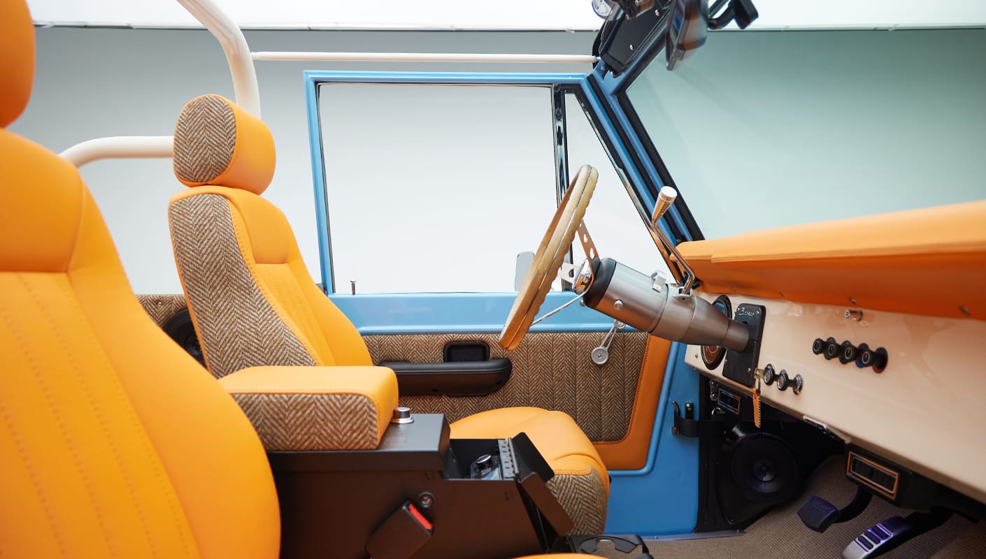1973 Classic Ford Bronco in frozen blue with rolls royce orange leather and alpaca interior interior detail