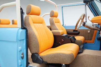 1973 Classic Ford Bronco in frozen blue with rolls royce orange leather and alpaca interior passenger seat