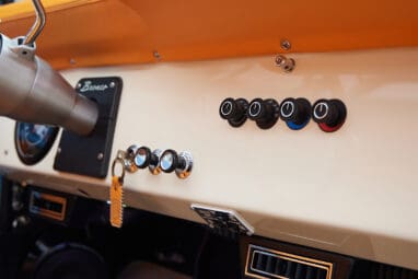 1973 Classic Ford Bronco in frozen blue with rolls royce orange leather and alpaca interior dash