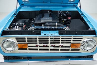 1973 Classic Ford Bronco in frozen blue with rolls royce orange leather and alpaca interior motor front