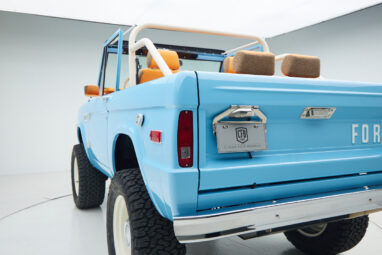 1973 Classic Ford Bronco in frozen blue with rolls royce orange leather and alpaca interior rear angle