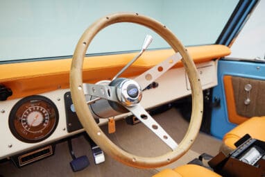 1973 Classic Ford Bronco in frozen blue with rolls royce orange leather and alpaca interior steering wheel