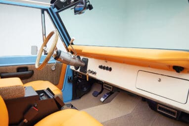 1973 Classic Ford Bronco in frozen blue with rolls royce orange leather and alpaca interior panel