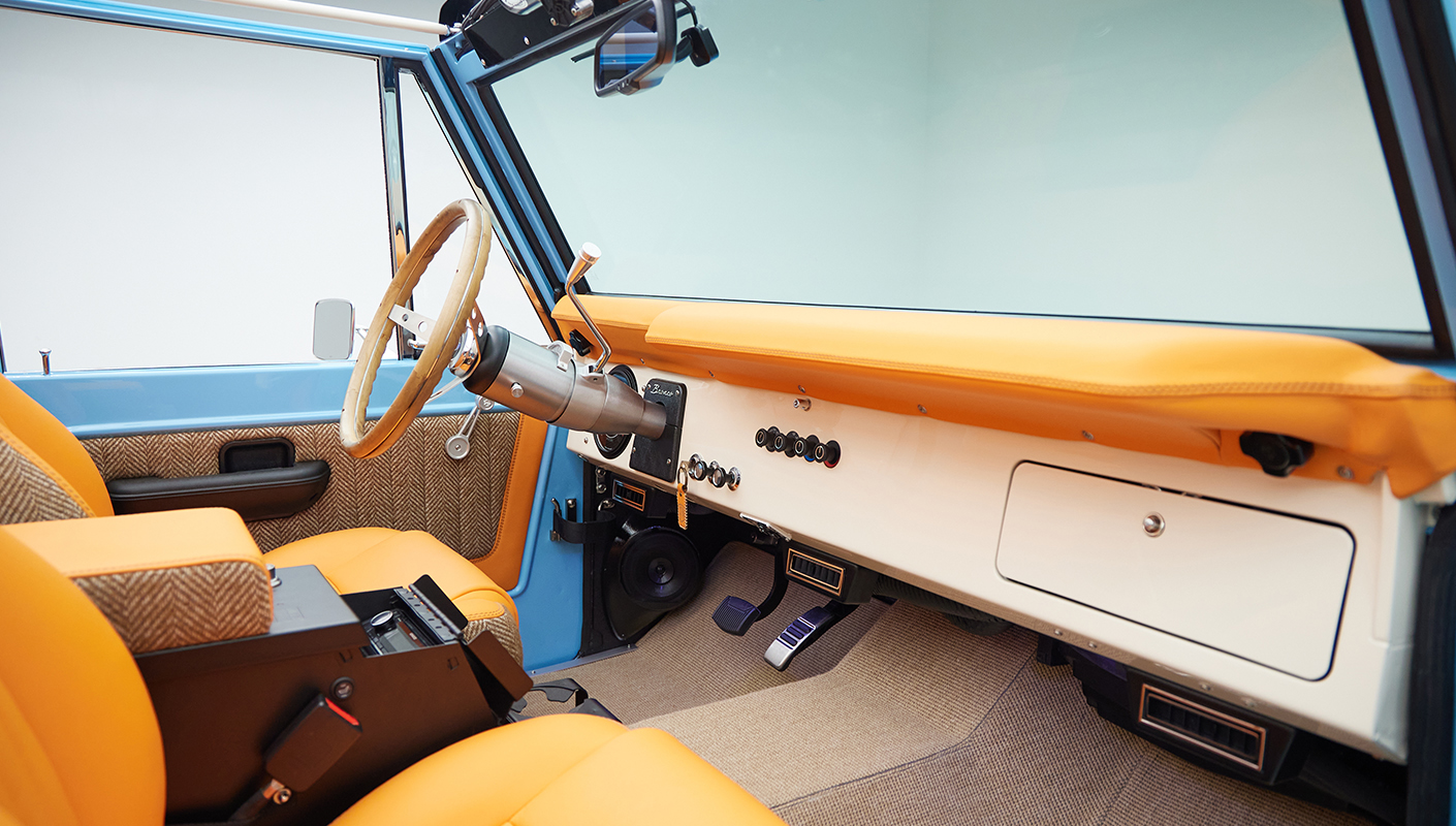 1973 Classic Ford Bronco in frozen blue with rolls royce orange leather and alpaca interior panel