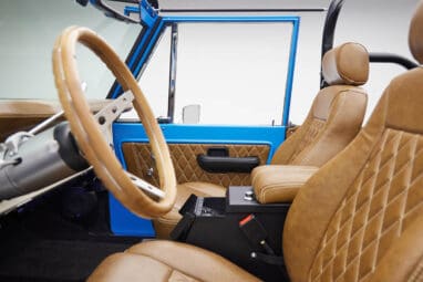 1976 classic ford bronco in blue patina paint with whiskey leather interior driver interior profile