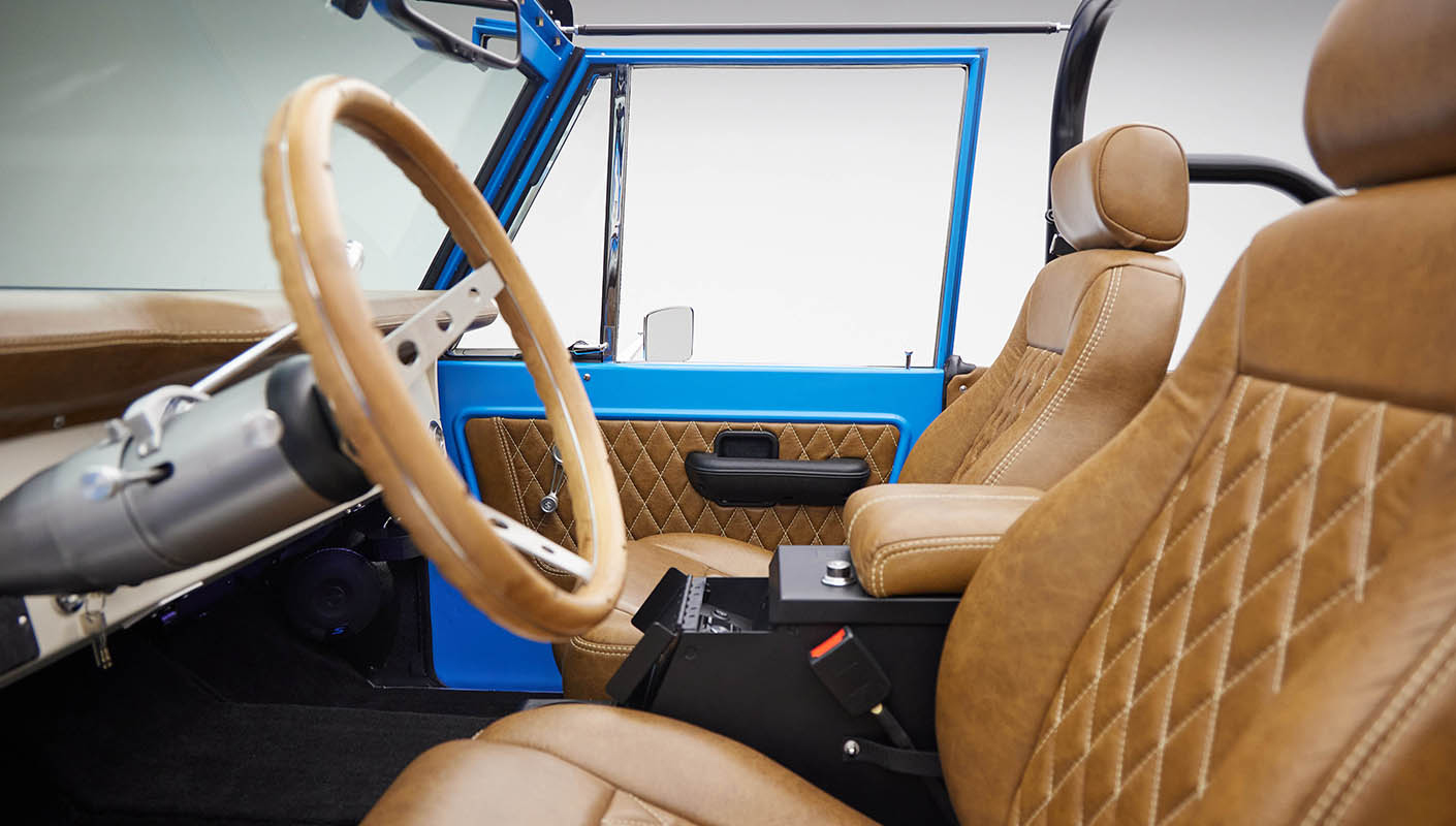 1976 classic ford bronco in blue patina paint with whiskey leather interior driver interior profile