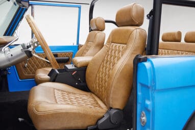 1976 classic ford bronco in blue patina paint with whiskey leather interior driver seat
