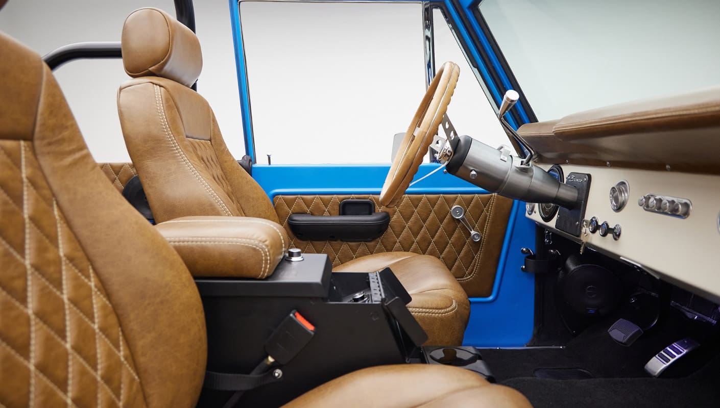 1976 classic ford bronco in blue patina paint with whiskey leather interior passenger interior profile