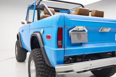 1976 classic ford bronco in blue patina paint with whiskey leather interior rear angle exterior