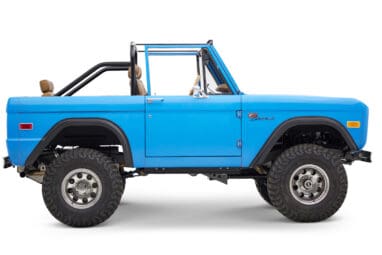 1976 classic ford bronco in blue patina paint with whiskey leather interior passenger profile