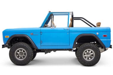 1976 classic ford bronco in blue patina paint with whiskey leather interior driver profile