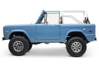 1974 classic ford bronco in stars & stripes blue with whiskey leather driver profile