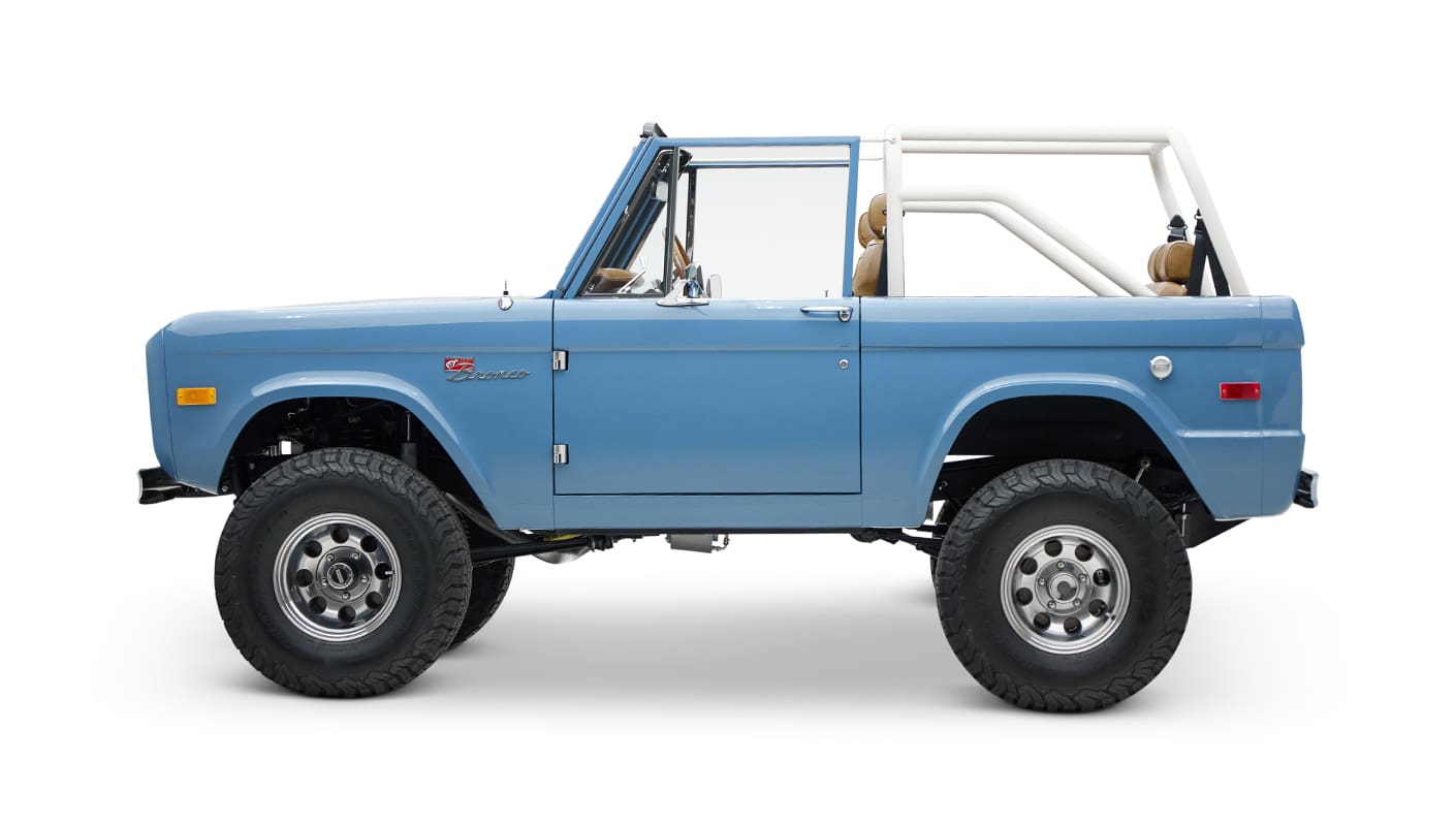 1974 classic ford bronco in stars & stripes blue with whiskey leather driver profile