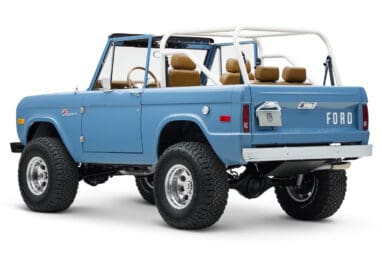 1974 classic ford bronco in stars & stripes blue with whiskey leather driver rear angle