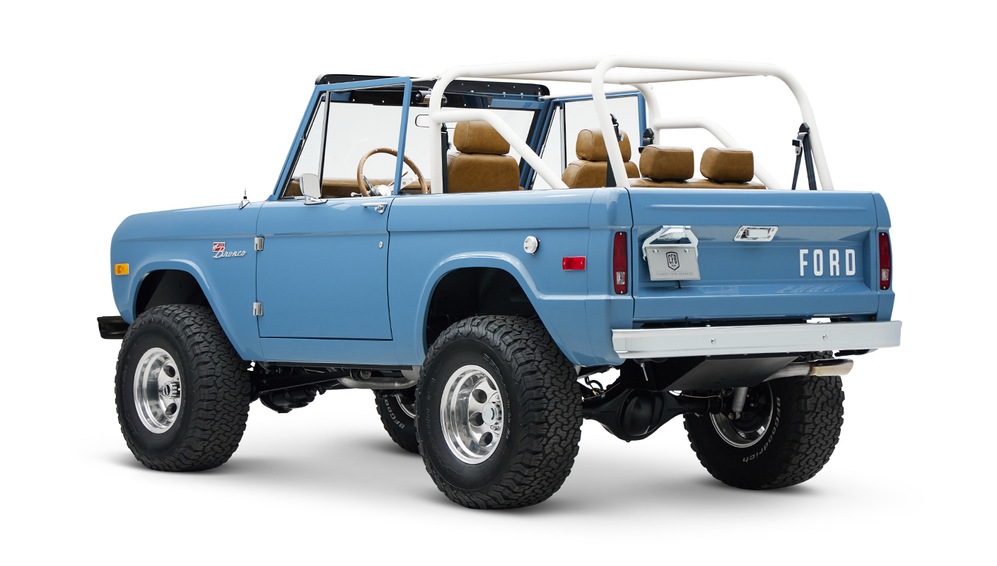 1974 classic ford bronco in stars & stripes blue with whiskey leather driver rear angle