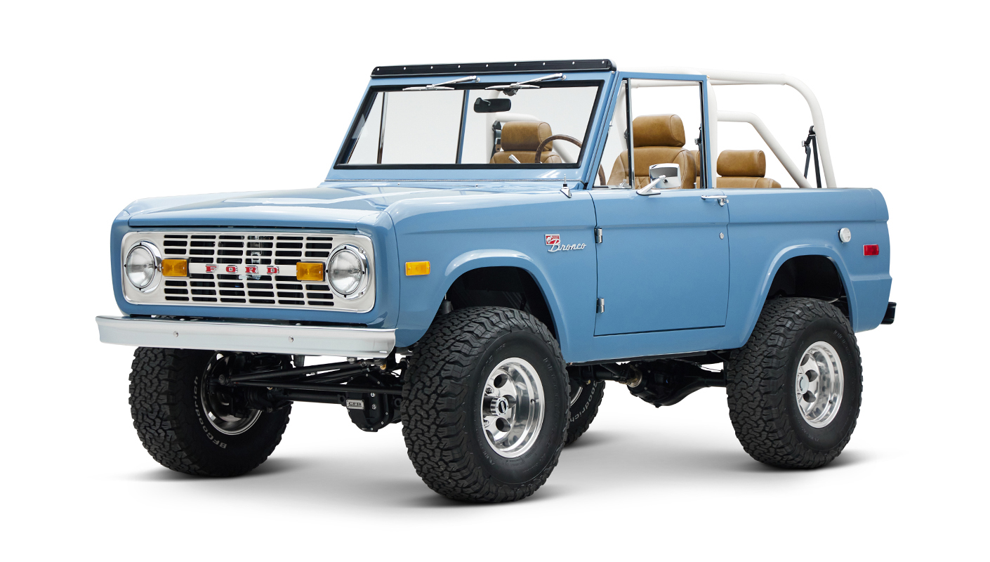 1974 classic ford bronco in stars & stripes blue with whiskey leather driver front angle