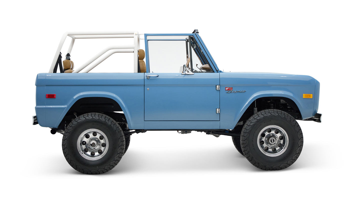 1974 classic ford bronco in stars & stripes blue with whiskey leather passenger profile