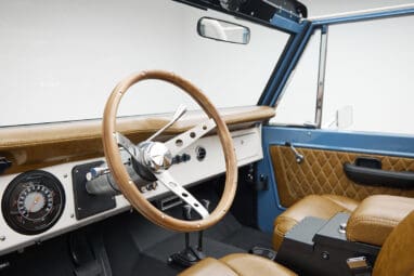 1974 classic ford bronco in stars & stripes blue with whiskey leather driver dash